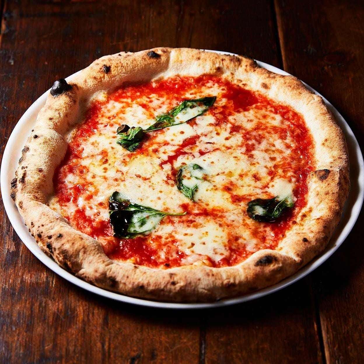 Authentic Neapolitan Pizza Margherita with the aroma of oven-baked pizza