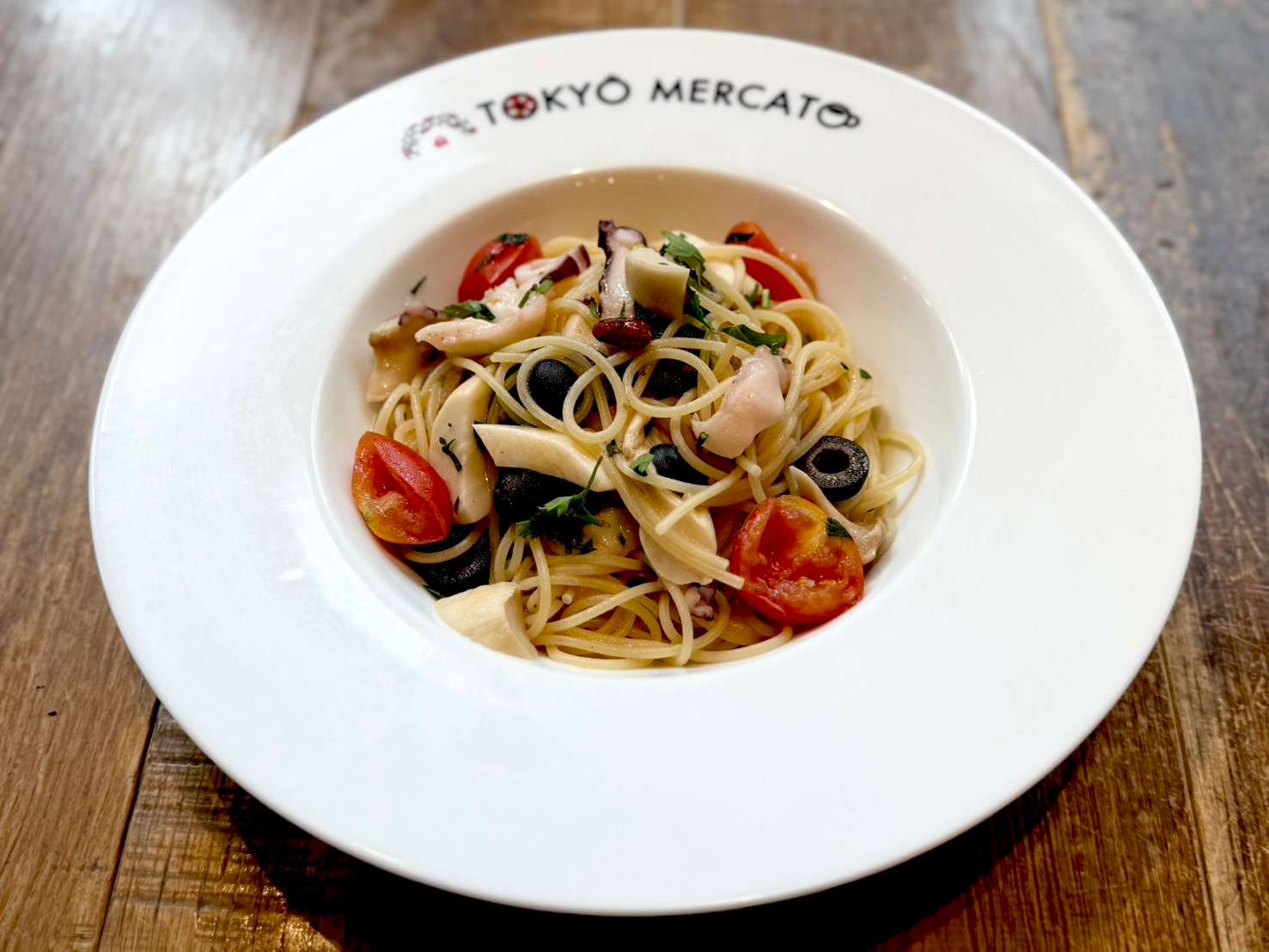 Octopus and colorful vegetables aglio e olio peperoncino