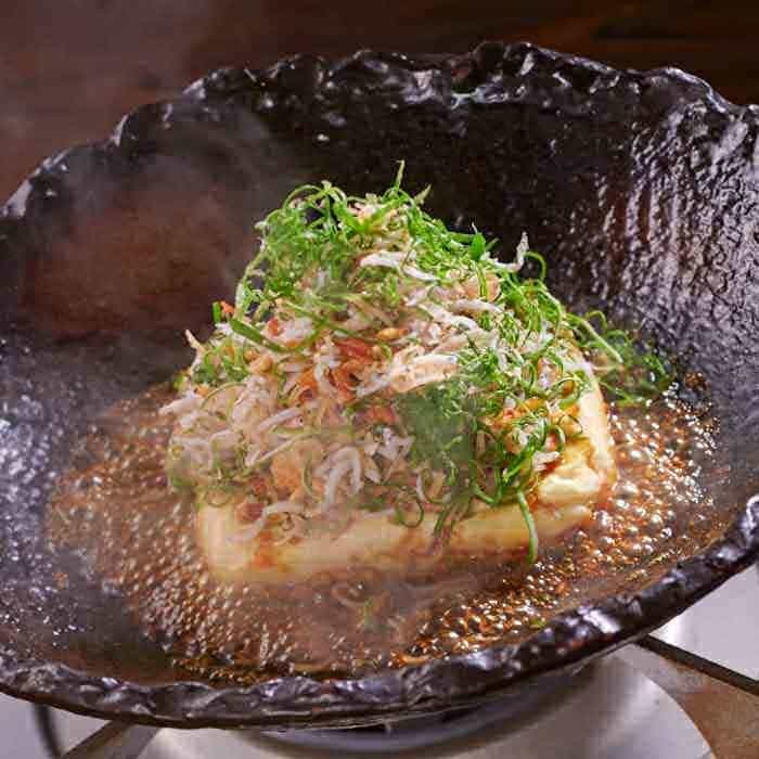 Warm tofu with small sardines and green onions