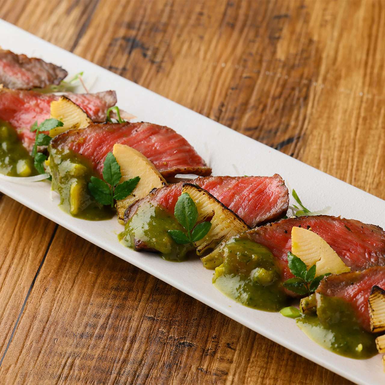 Seared Wagyu beef and bamboo shoots simmered in Tosa-style sauce with green onion pesto miso.