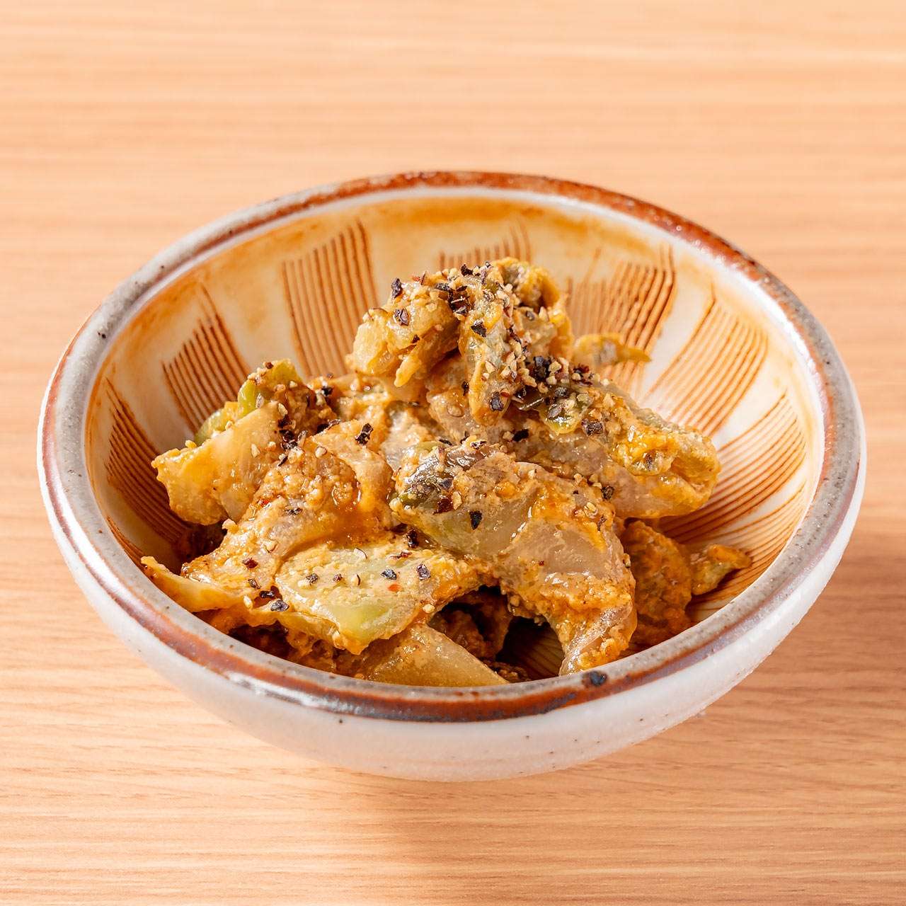 Sesame-covered spicy pickled mustard greens