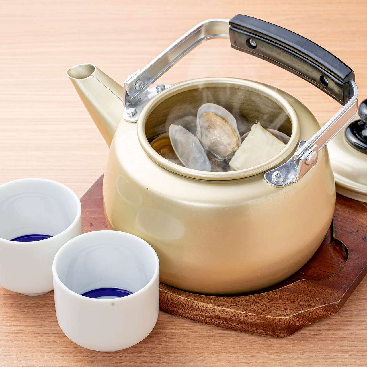 Clams steamed in butter in a kettle