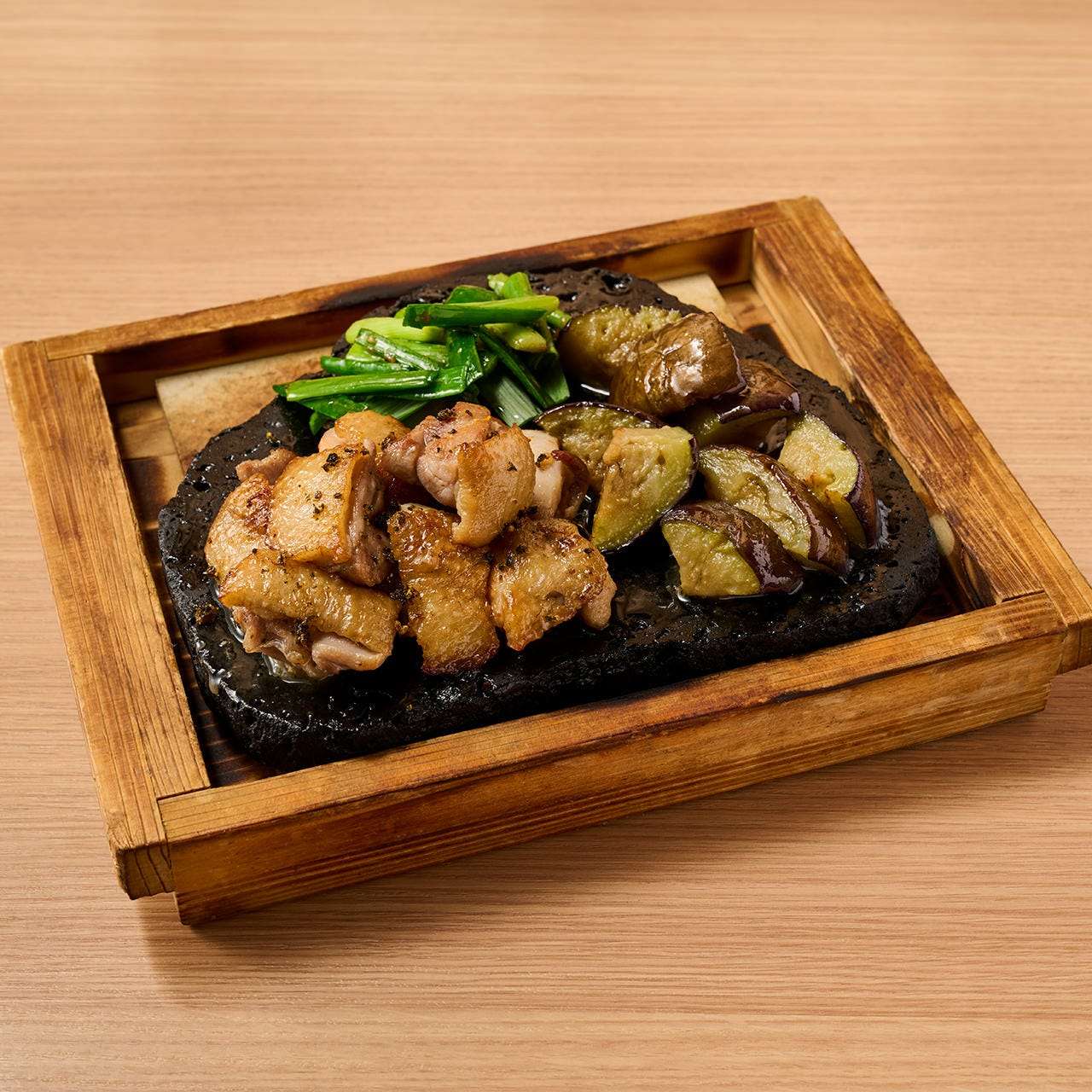 Nagoya Cochin and soft eggplant grilled on lava