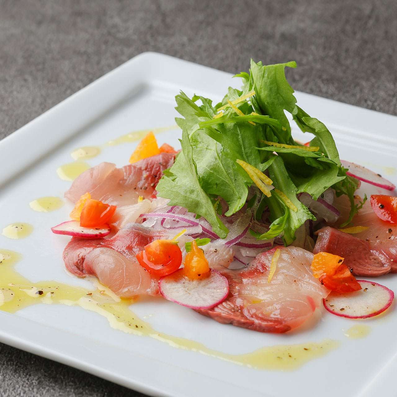 昆布〆鰤と春菊のカルパッチョ ～温州みかんソース～